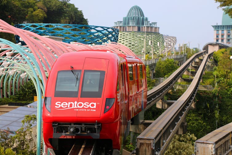 Red locomotive on rails.