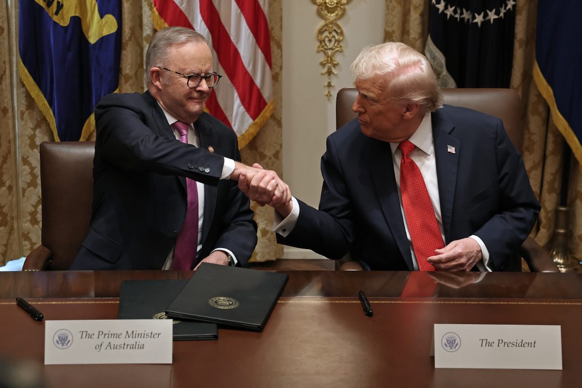 President Trump and Prime Minister Albanese shake hands.