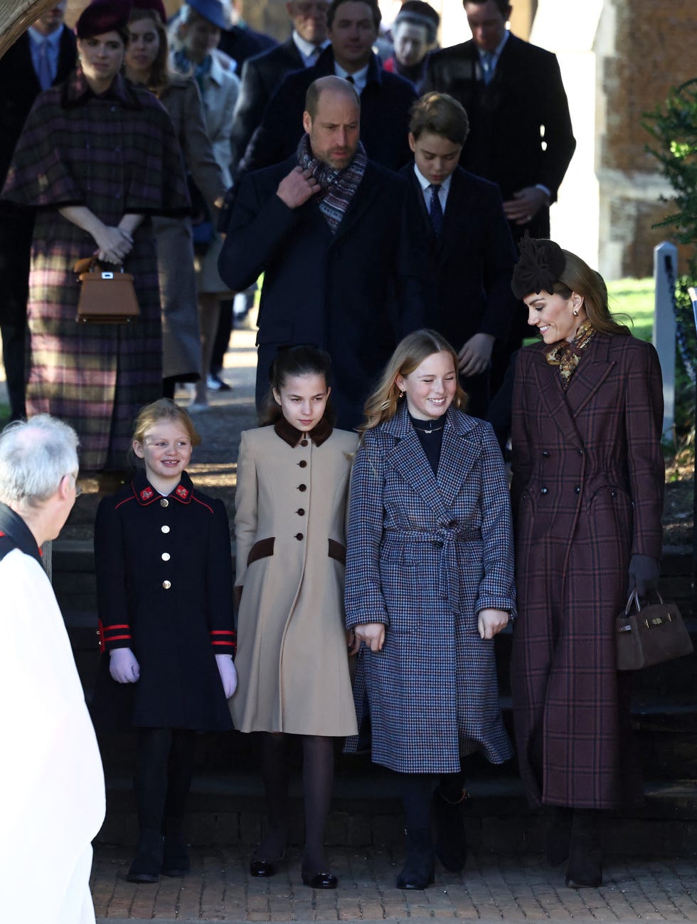 britain's princess eugenie of york (l), britain's princess beatrice of york (2l), britain's prince william, prince of wales (c), britain's prince george of wales and front row from l, lena tindall, britain's princess charlotte of wales, mia tindall, and britain's catherine, princess of wales (r) leave after attending the royal family's traditional christmas day service at st mary magdalene church on the sandringham estate in eastern england, on december 25, 2025. (photo by henry nicholls / afp)
