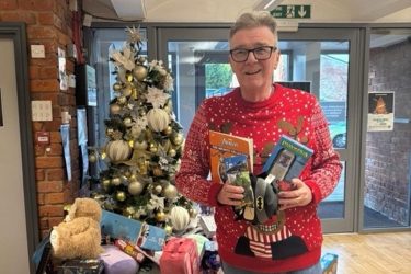 John 'Gilly' Gillmore making a donation to the Cotton Court Barnardo's gift appeal