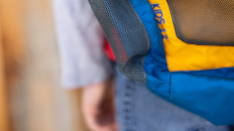 An Apple AirTag on a backpack