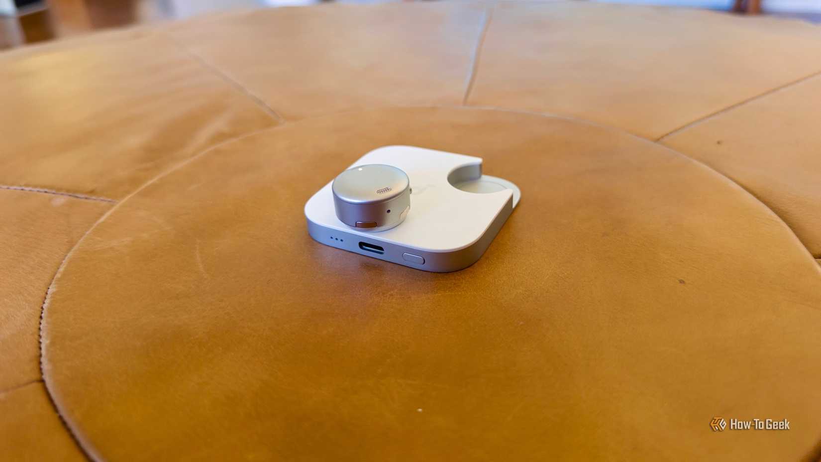 Anker Soundcore Work mic sitting on top of the battery case.