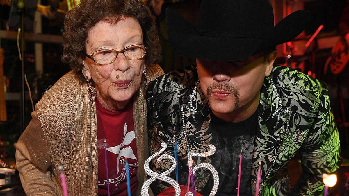 John Rich with Granny Rich blowing out birthday candles