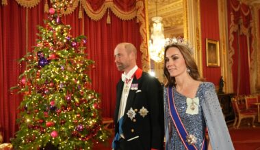 Prince William and Kate Middleton walk past a lit Christmas tree as they arrive at the state banquet for the German President Frank-Walter Steinmeier and his wife Elke Budenbender at Windsor Castle on December 3, 2025