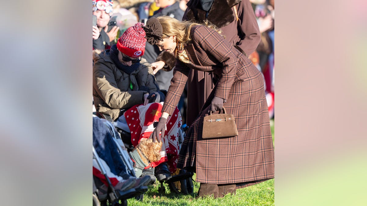 Kate Middleton petting a dog on Christmas Day.