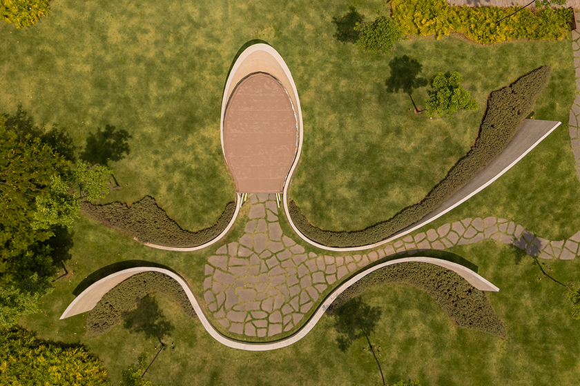 curving concrete walls encircle nest chapel’s intimate timber core in são paulo