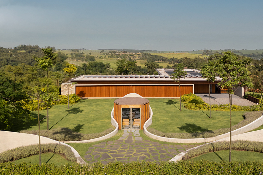 curving concrete walls encircle nest chapel’s intimate timber core in são paulo