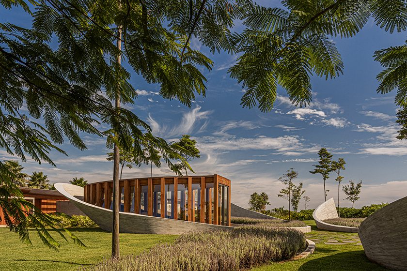 curving concrete walls encircle nest chapel’s intimate timber core in são paulo