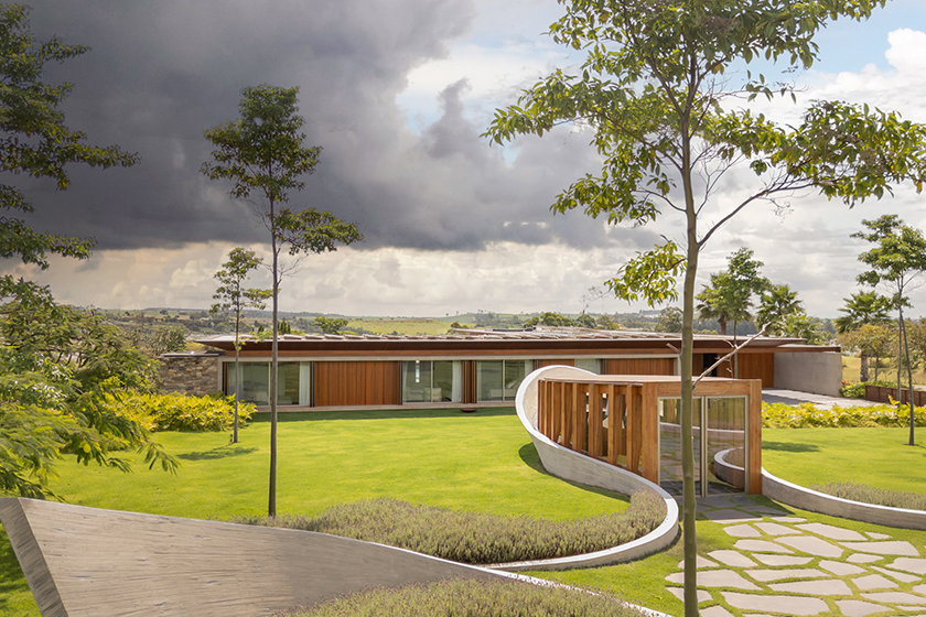 curving concrete walls encircle nest chapel’s intimate timber core in são paulo