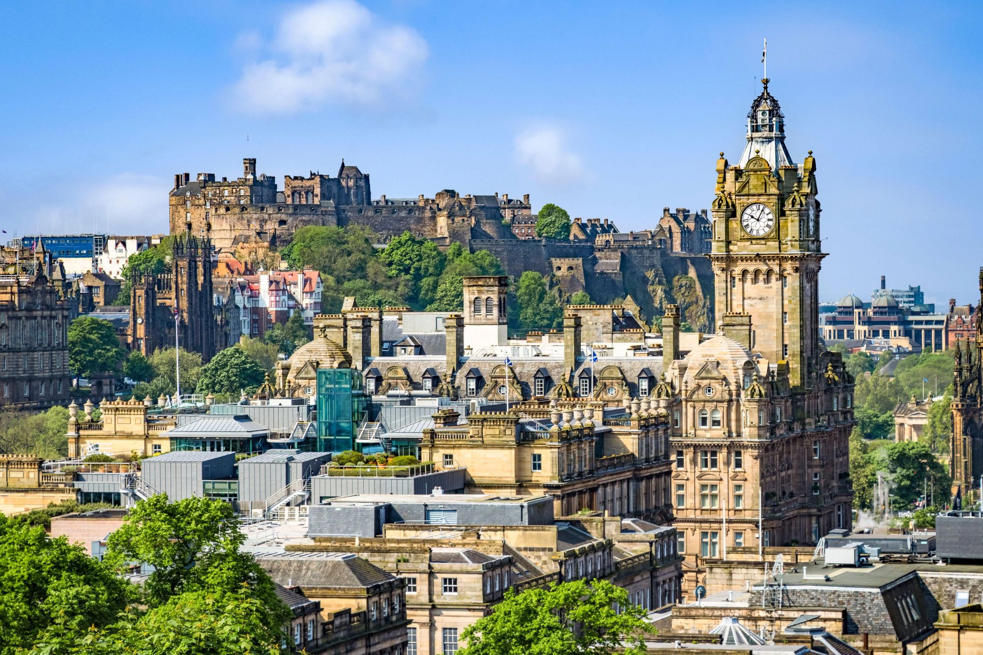 An image collage containing 1 images, Image 1 shows Edinburgh city center from Calton Hill, looking towards the Balmoral Hotel and Edinburgh Castle