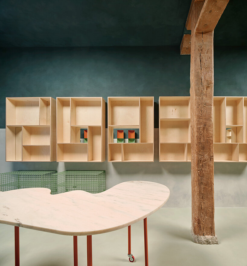 organic marble tables and vibrant hues complete madrid store by lucas y hernández-gil