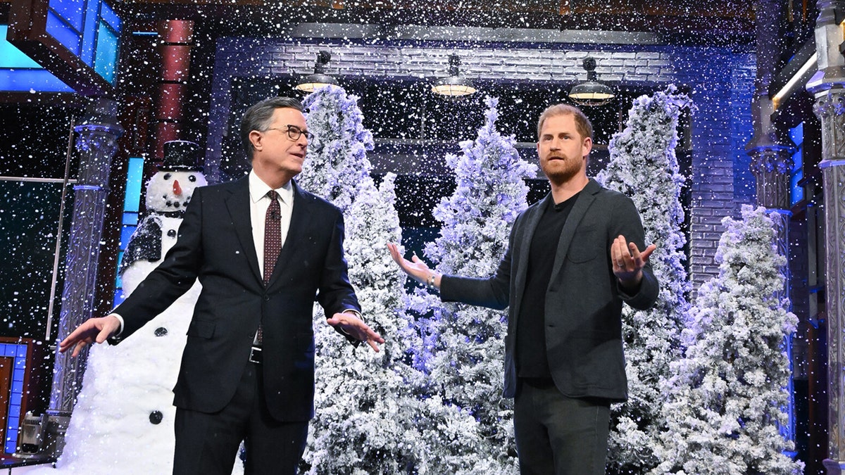 Stephen Colbert and Prince Harry acting out a wintry skit on set.