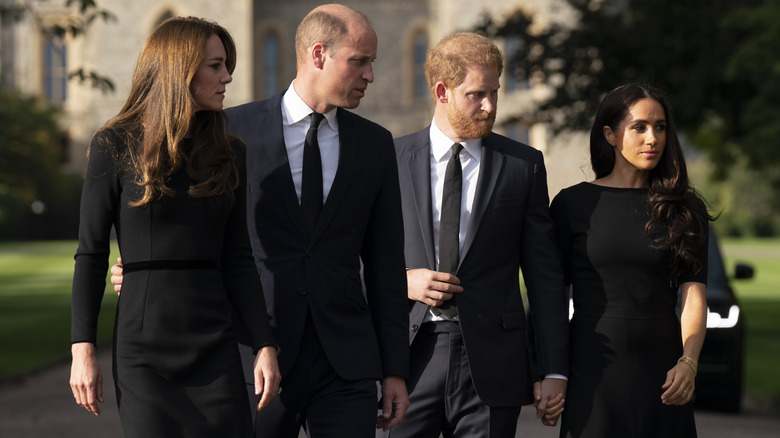 Kate Middleton, Prince William, Prince Harry, and Meghan Markle walking together