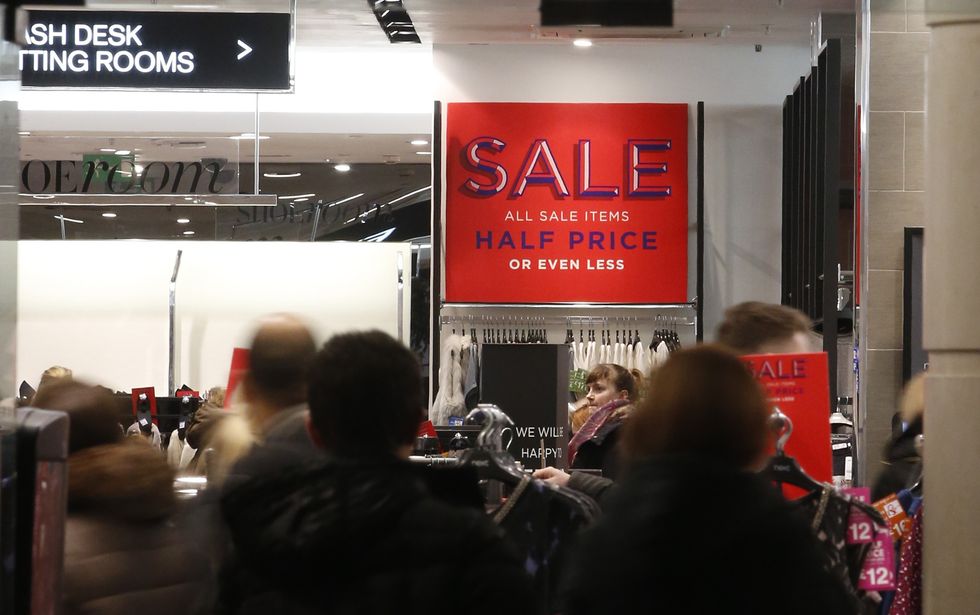 Shoppers in a Next store in Liverpool city centre as the Boxing Day sales get underway