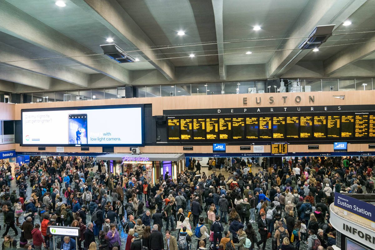 london euston concourse screens full of people