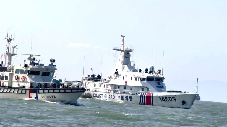 A Taiwan Coast Guard vessel travels near a China Coast Guard vessel. Pic: Reuters