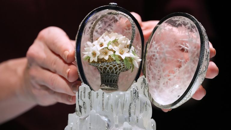 This egg opens to reveal a removable tiny basket of quartz flowers symbolising spring. Pic: AP