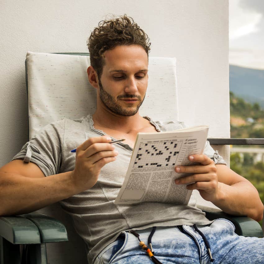 man doing a crossword puzzle to handle stress