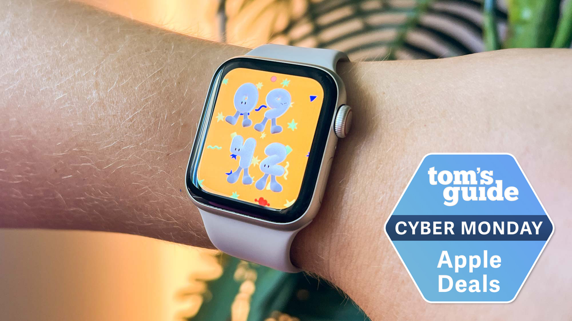 Apple Watch SE 2 with Tom's Guide Cyber Monday Apple Deals badge