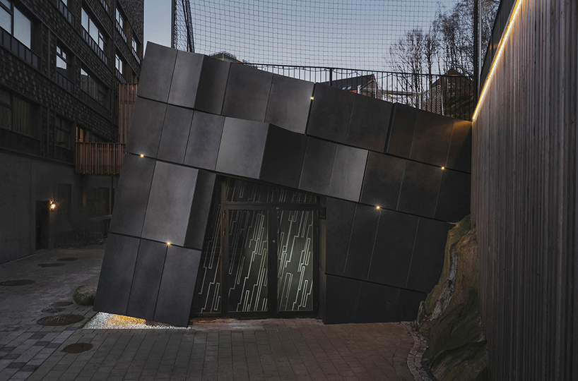 erdegard arkitekter carves 'mountain chamber' threshold to rock cavern in sweden