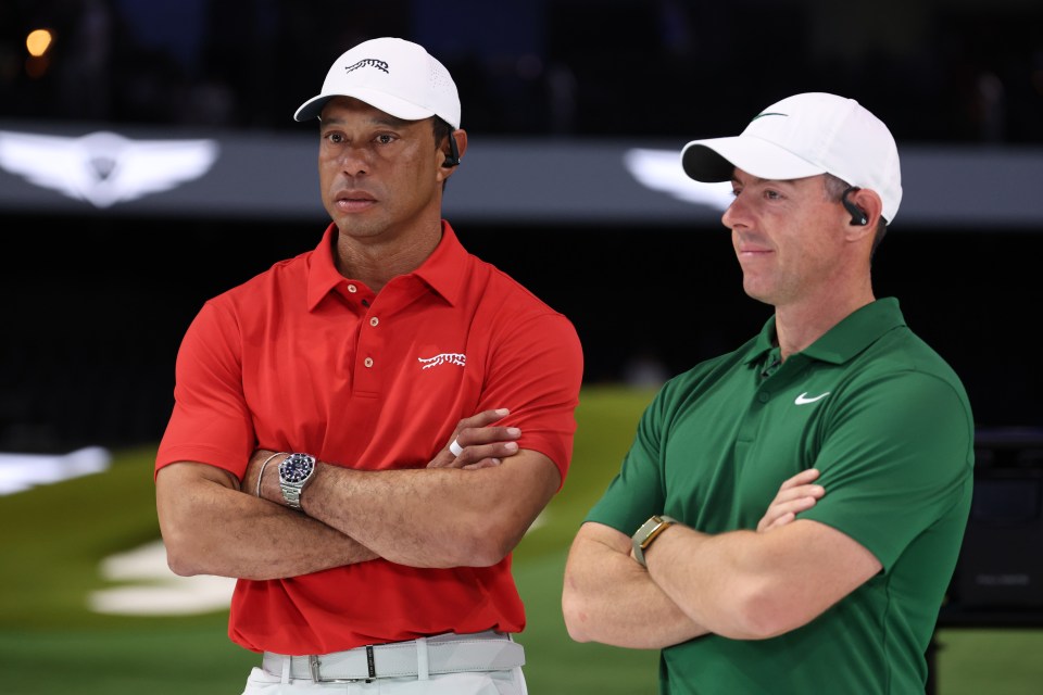 Tiger Woods of Jupiter Links Golf Club and Rory McIlroy of Boston Common Golf look on after their TGL presented by SoFi match at SoFi Center on January 27, 2025 in Palm Beach Gardens, Florida. 