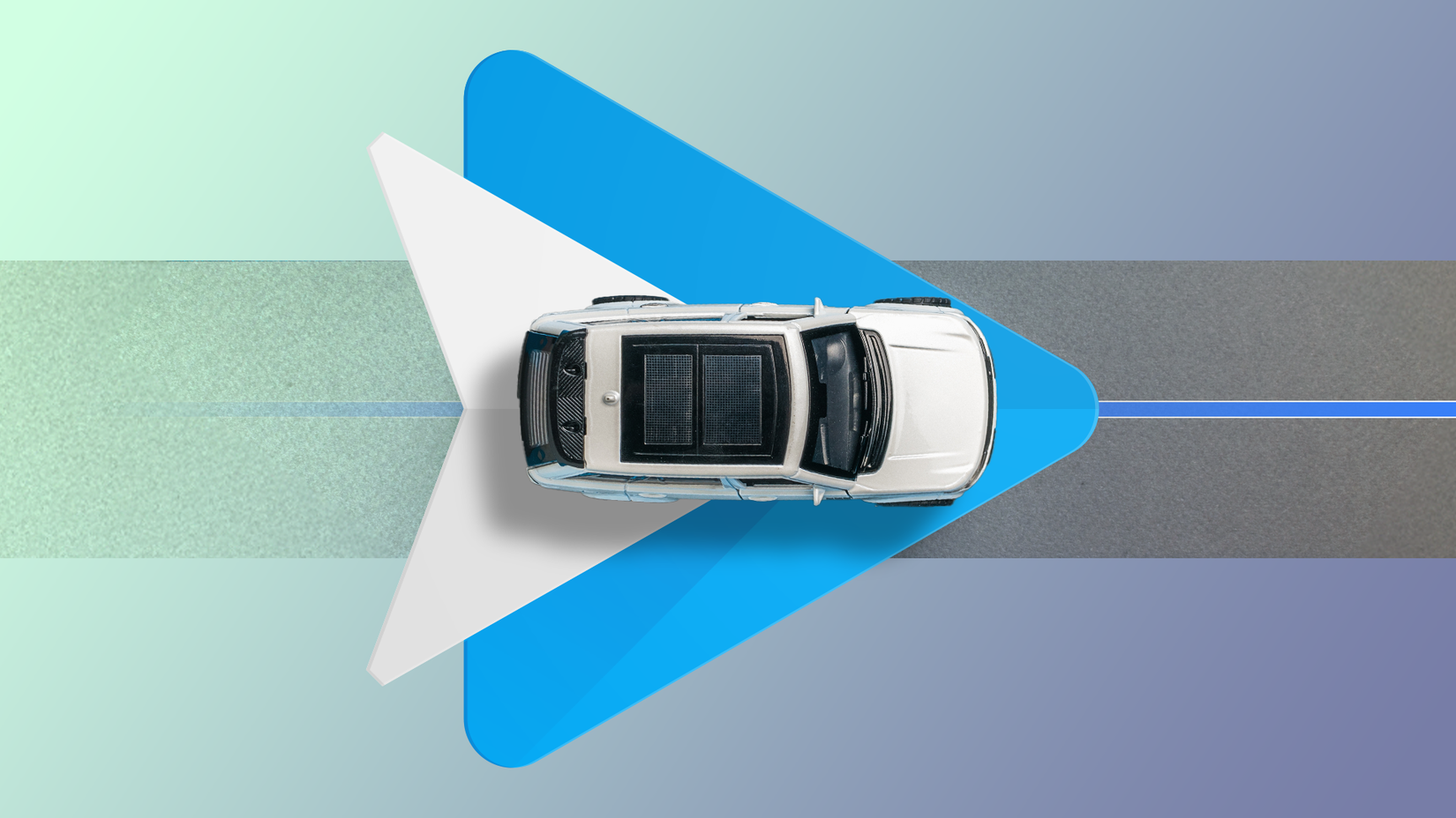 Top view of a car driving over the Android Auto logo.