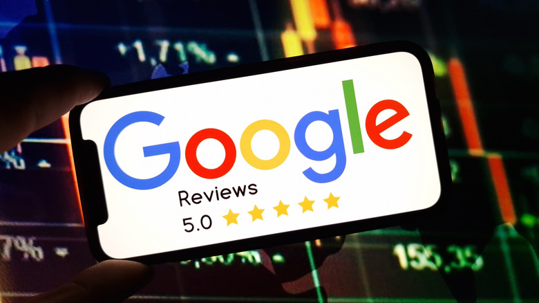 Google logo with star ratings on a phone