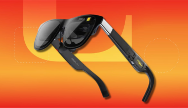 Xreal One AR glasses on orange-yellow CNET background.