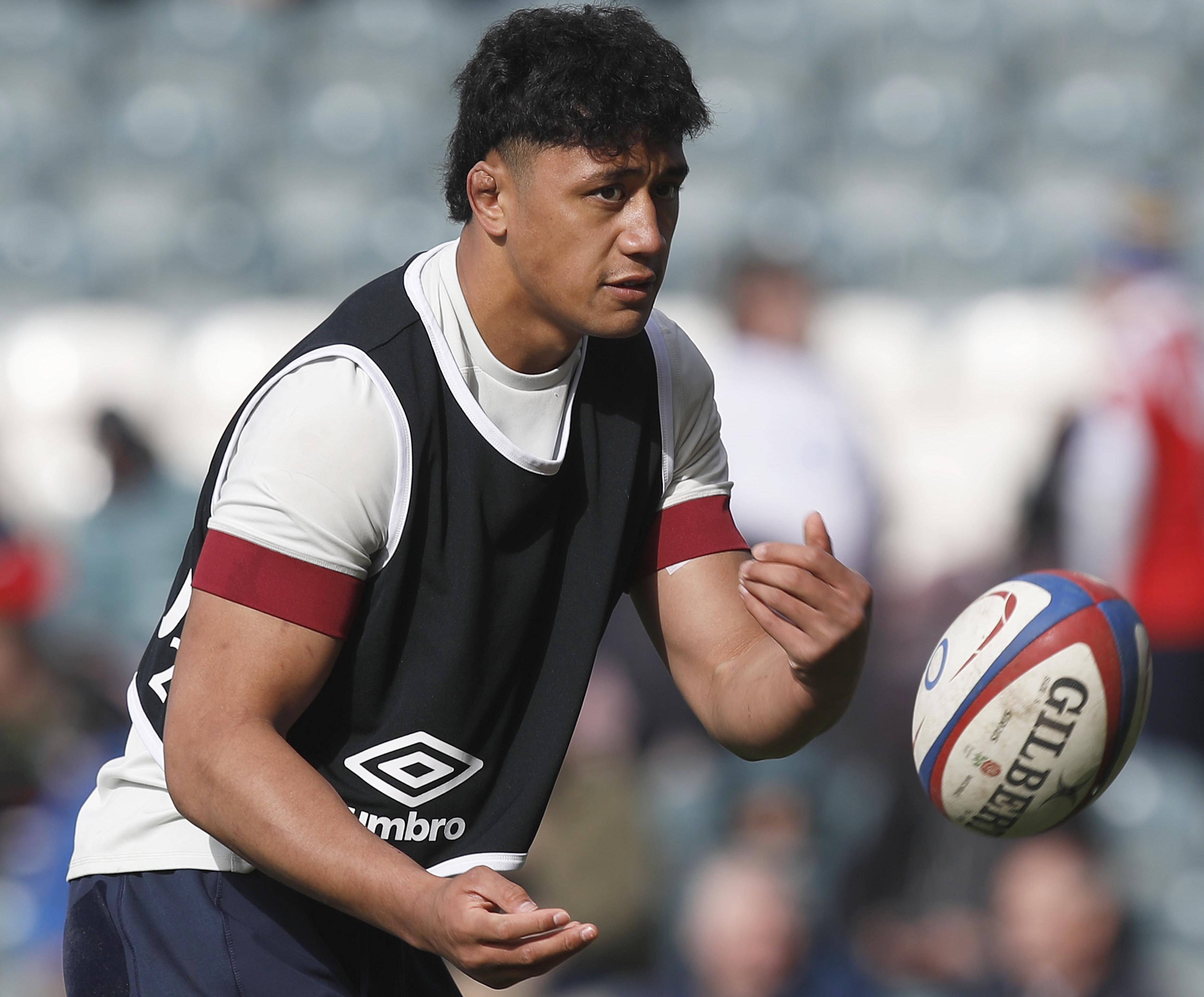 England A player Greg Fisilau (Exeter Chiefs) during the warm-up, looking intently at a rugby ball in mid-air.