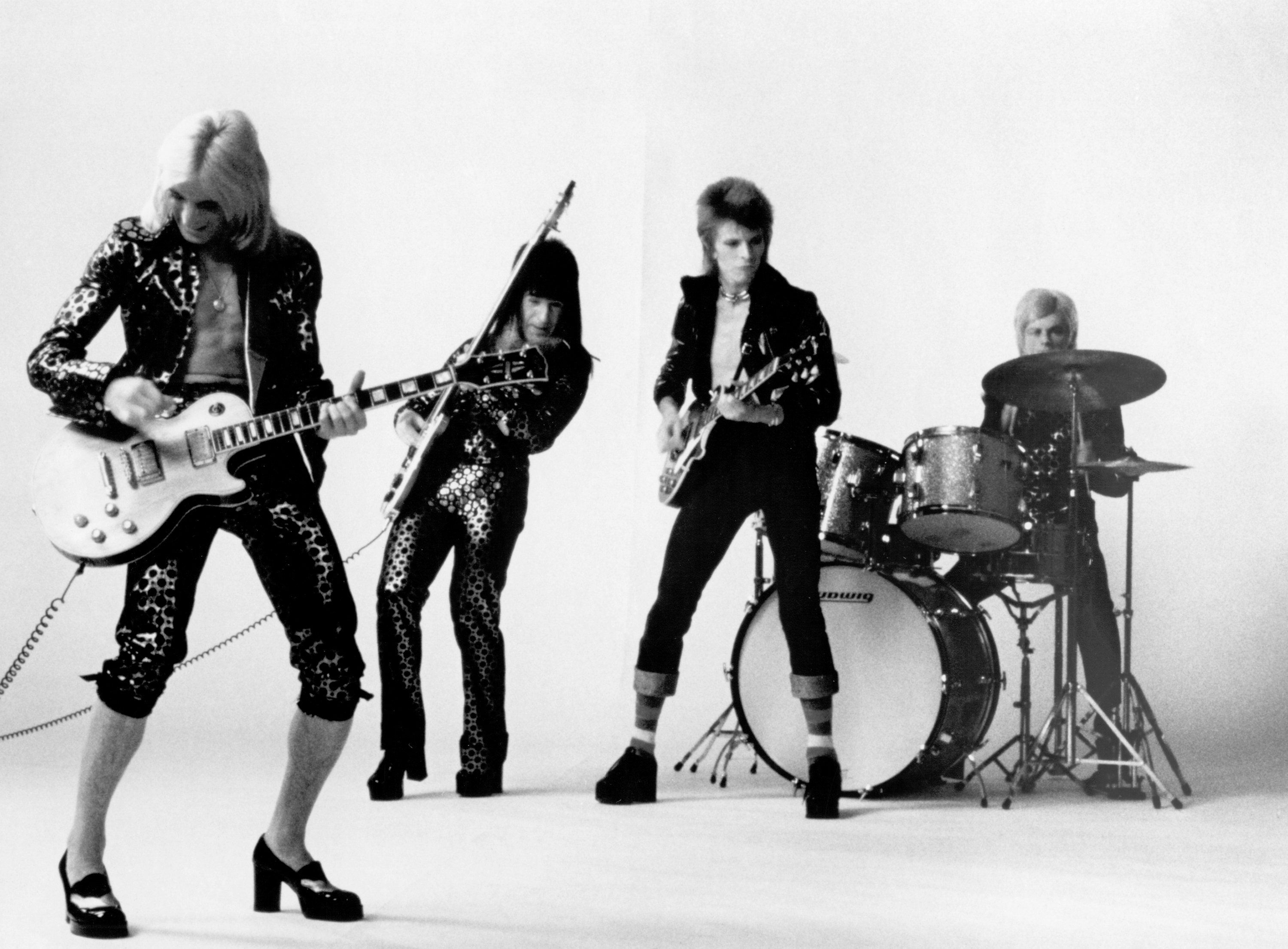 Black and white portrait of The Spiders From Mars: Mick Ronson, Trevor Bolder, David Bowie, and Mick Woodmansey.