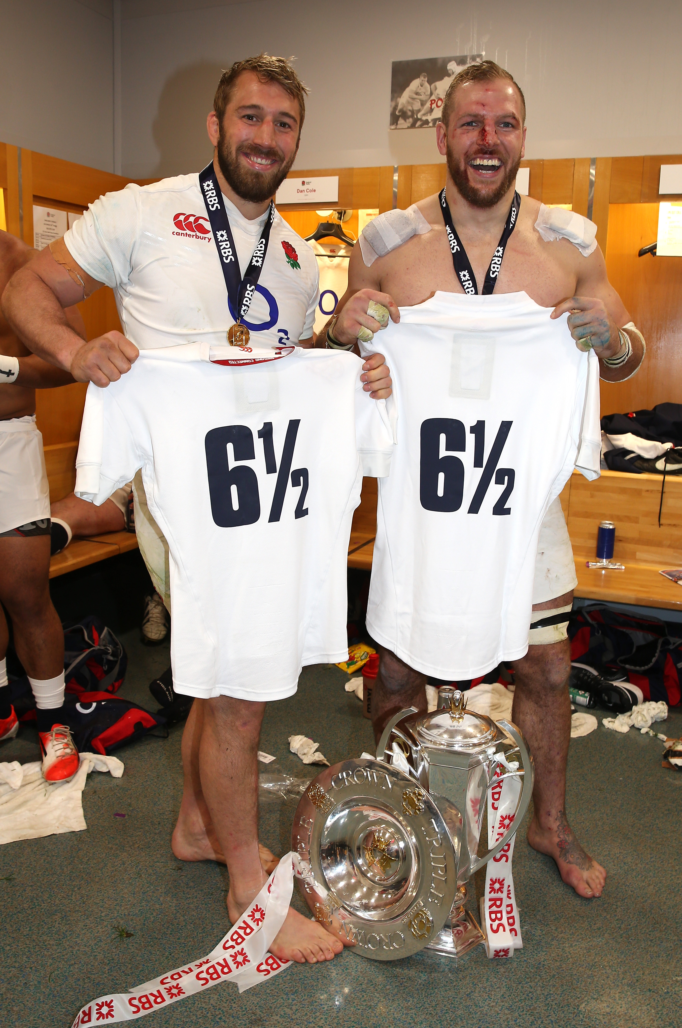 Chris Robshaw and James Haskell of England celebrating with their championship trophy and "6 1/2" shirts.