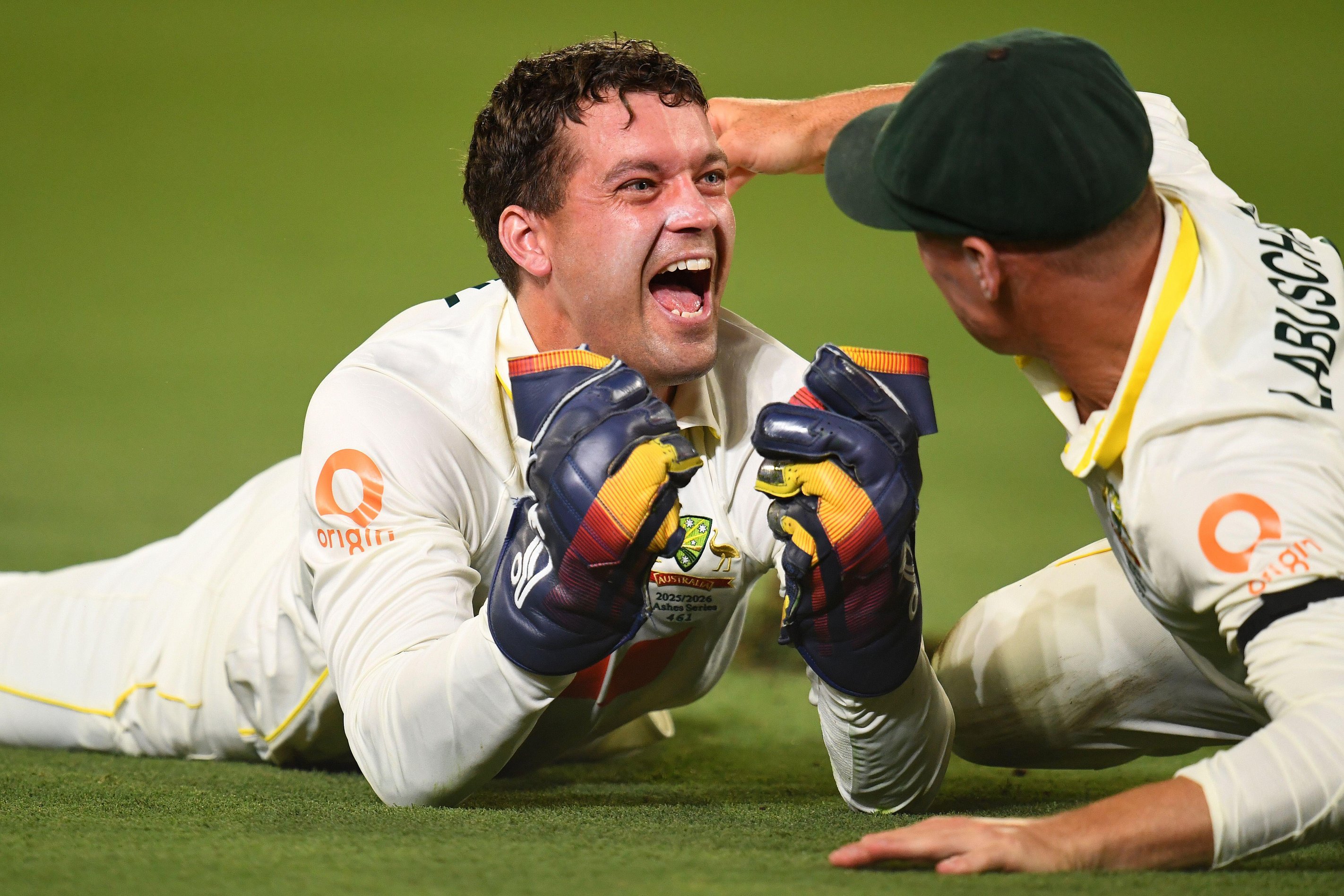 Brisbane, Australia. 04th Dec, 2025. Alex Carey of Australia celebrates taking a catch with team mate Marnus Labuschagne during Day one of the Second Men's Ashes Test between Australia and England at The Gabba in Brisbane, Thursday, December 4, 2025.