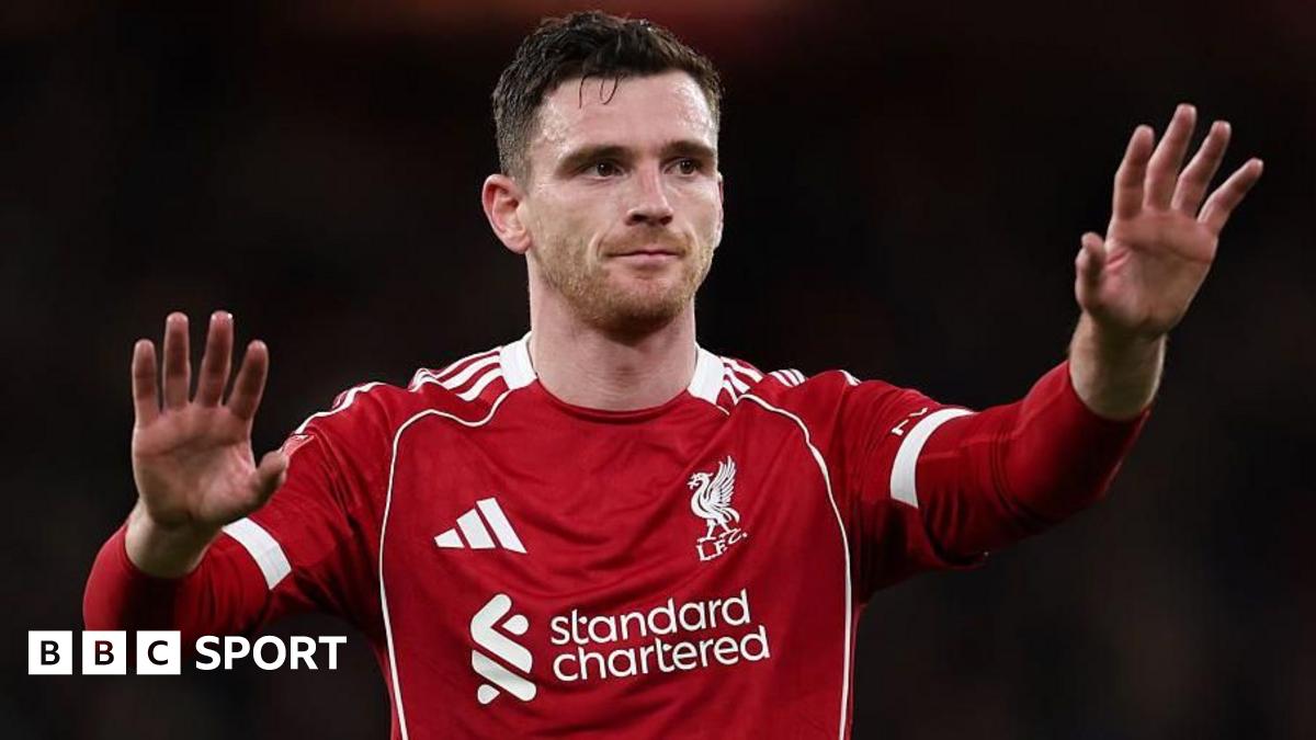 Andy Robertson holds up his hands in a calming gesture during a Liverpool game