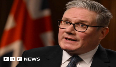 Prime Minister Sir Keir Starmer being interviewed by Laura Kuenssberg for the BBC's Sunday with Laura Kuenssberg programme. He wears a black suit, a white shirt and a navy patterned tie.