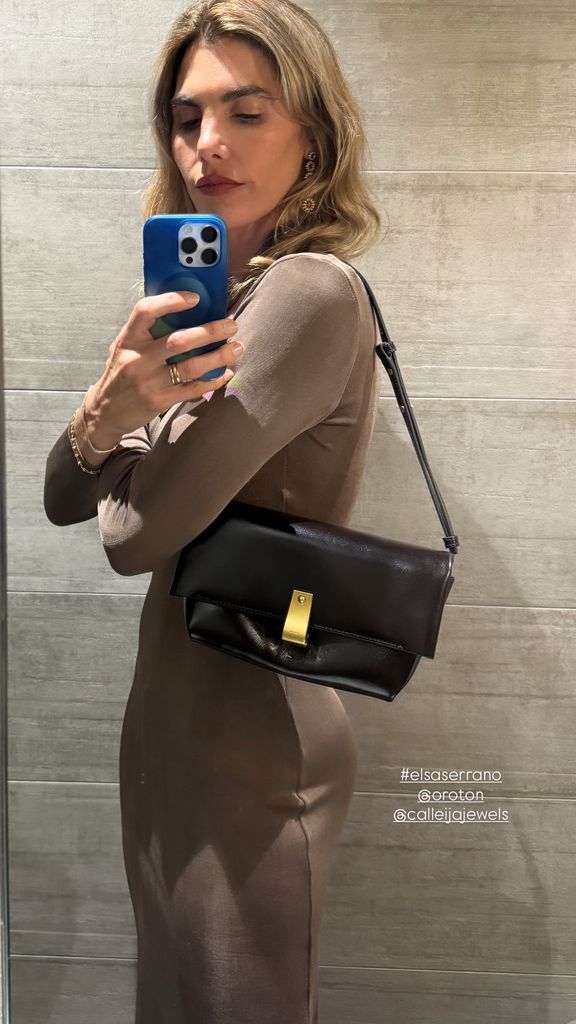 A photo of Delfina Blaqiuer wearing a brown dress