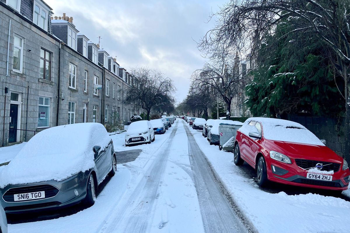 Snow covers roads and cars in Aberdeen. Weather warnings for snow have been upgraded to amber in some parts of the UK while yellow warnings are in place elsewhere. 