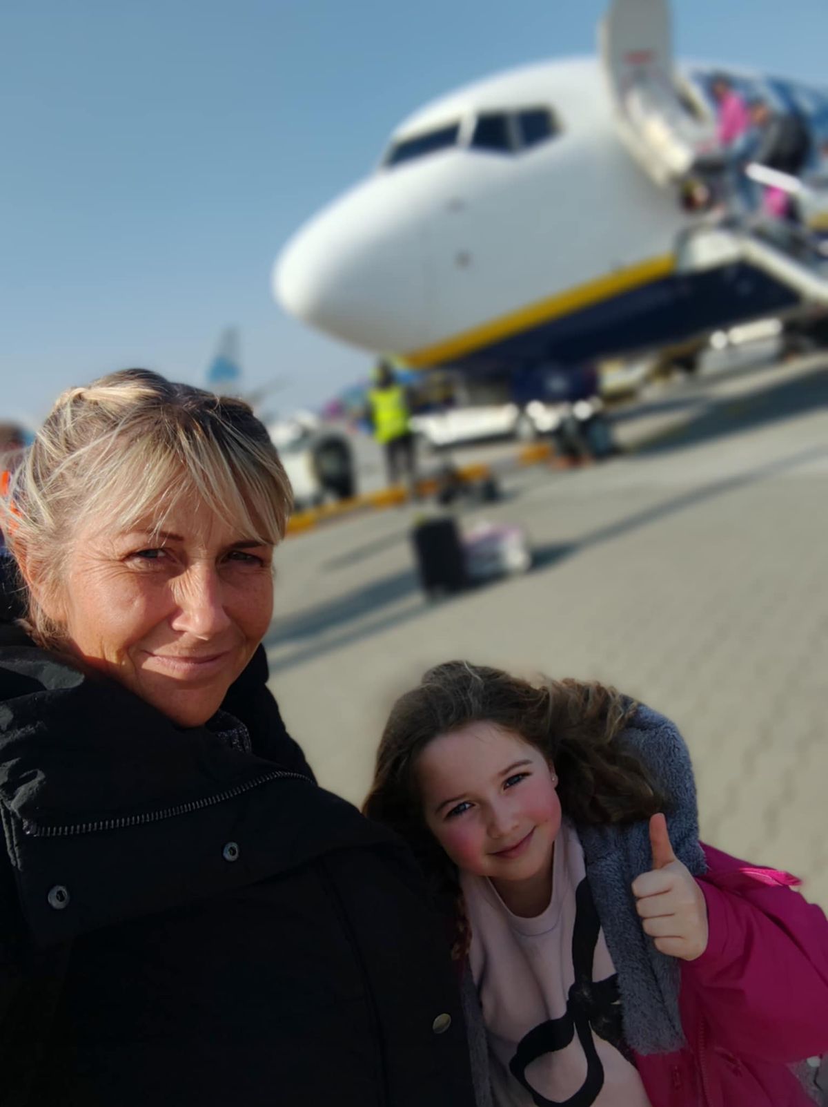 Amanda with her daughter Aarla before taking off at Edinburgh Airport. 