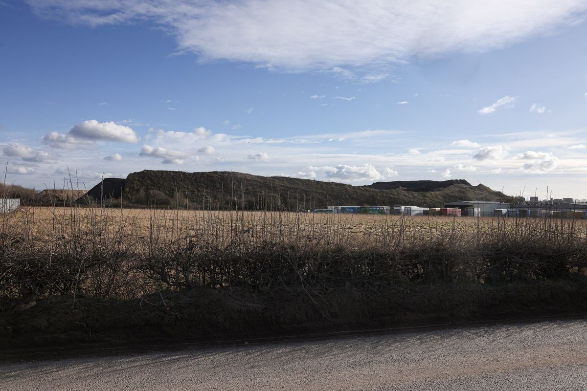 A large mound of material on Simonswood Industrial Estate near Kirkby