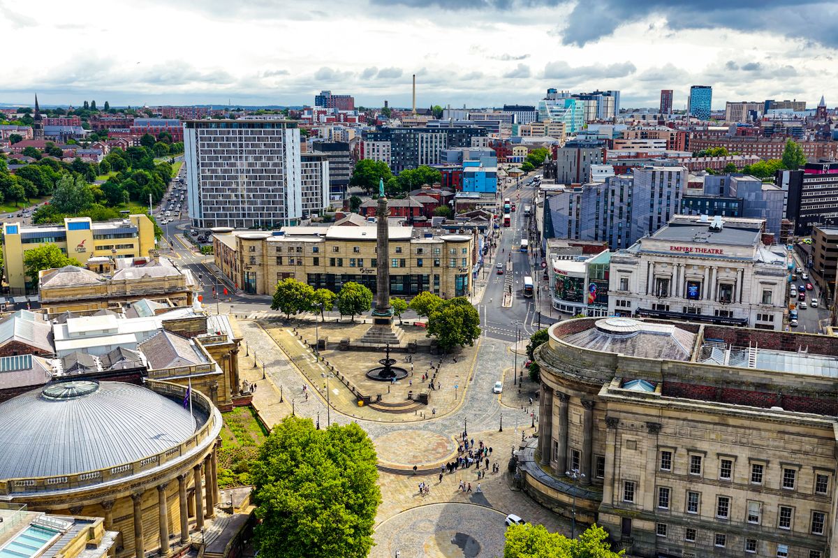 Liverpool’s city center featuring Wellington’s Column and the Sir Arthur Bower Forwood Statue on William Brown Street
