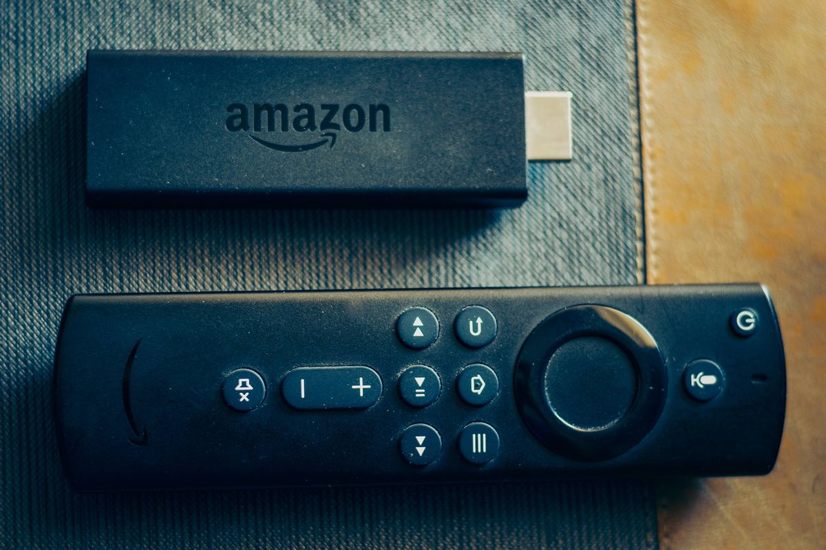 Amazon fire stick TV remote in hand