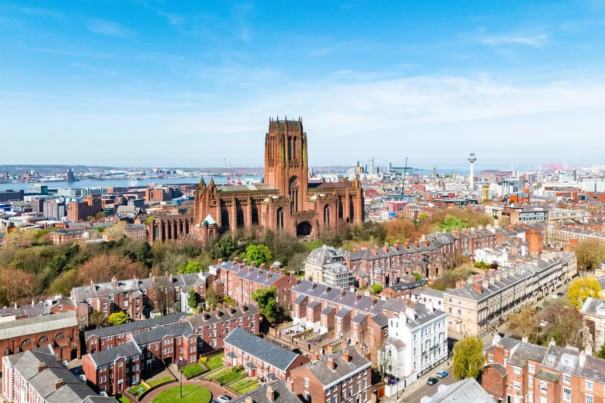An aerial photo of the Liverpool city centre with the Liverpool cathedral in the middle