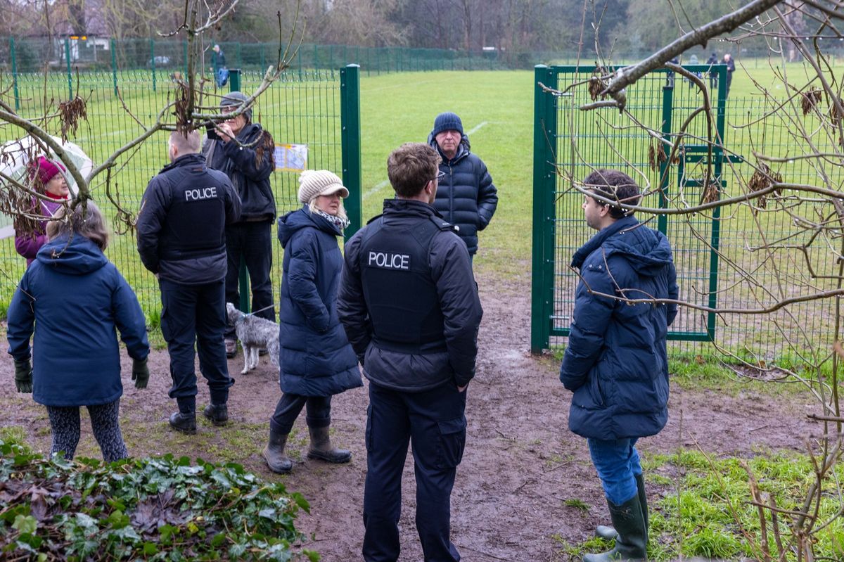 Residents with police at Cotham School's Stoke Lodge Playing Field in Bristol, Thursday, January 15, 2026