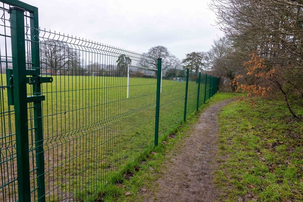 The fence and a lockable gate, erected by Cotham School around its playing fields at Stoke Lodge in Bristol