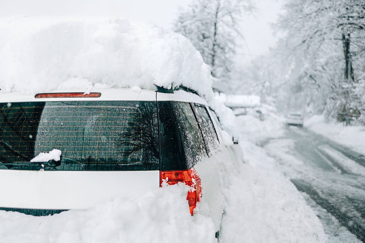 Car buried under deep snow after heavy snowfall