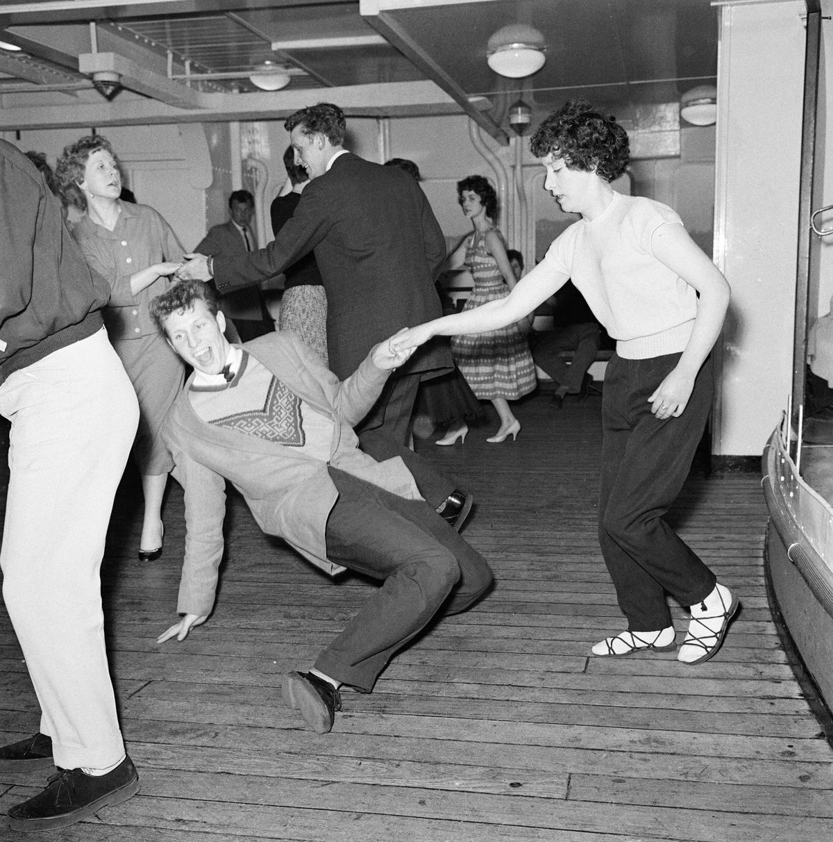 People dancing to rock and roll music on the Royal Iris in 1958