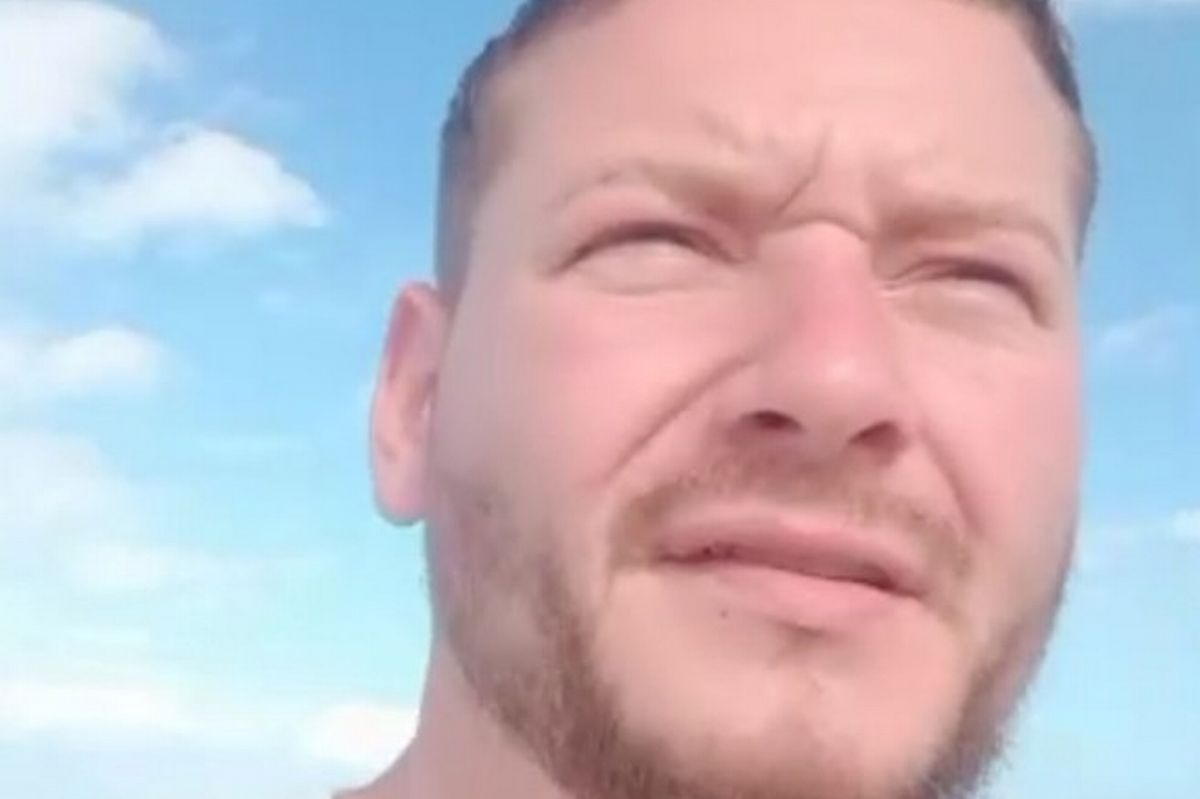 Man in his 30s with brown hair and ginger beard