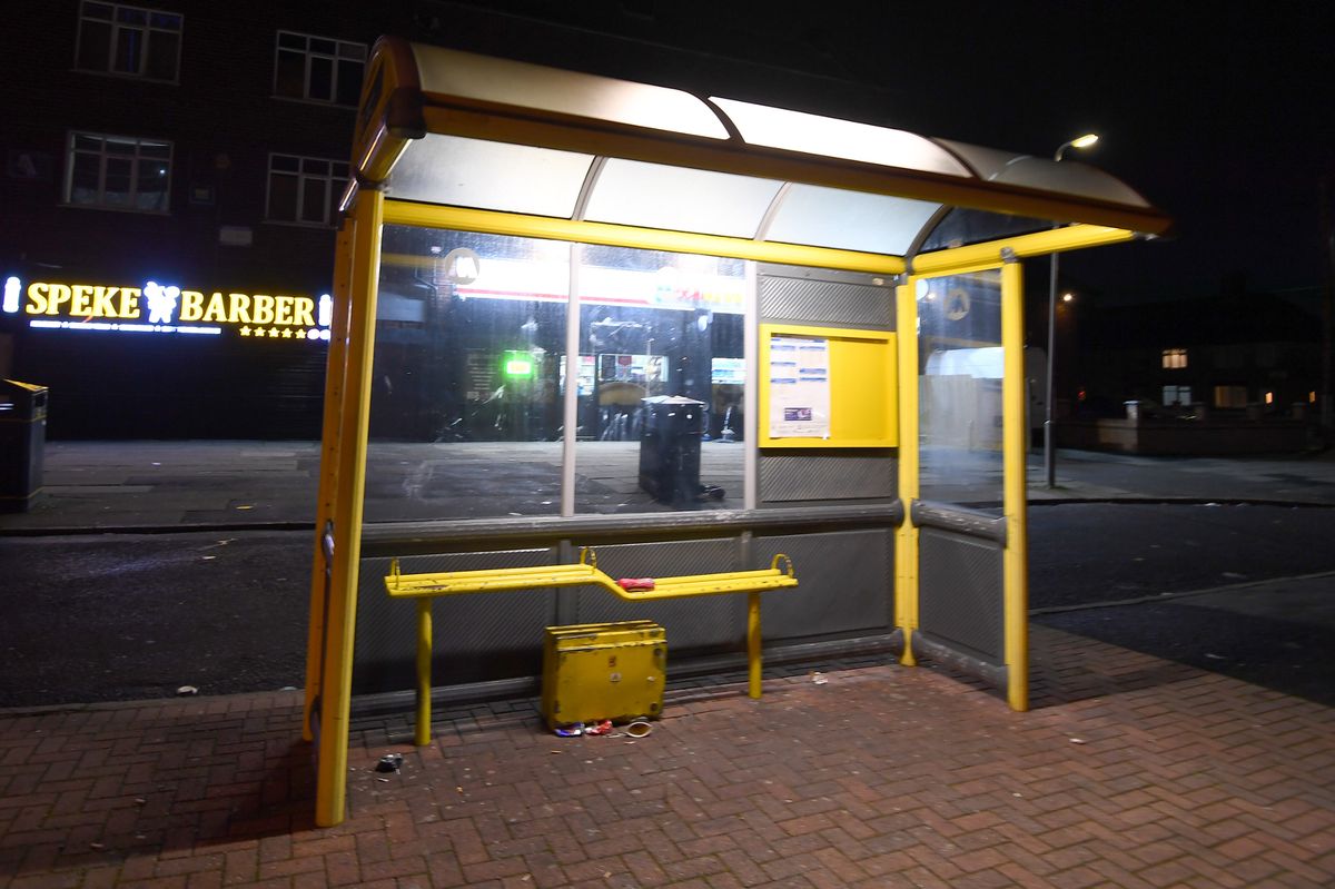 An empty bus stop on Western Avenue in Speke on Saturday night after buses were suspended