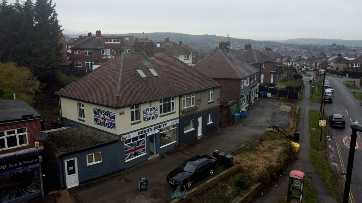 Picture of the house from above showing the road and behind