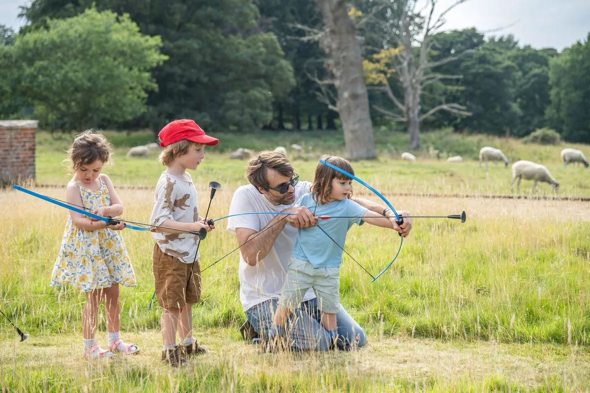 Families enjoying 'Summer of Play' activities in the gardens at Felbrigg Hall, Norfolk