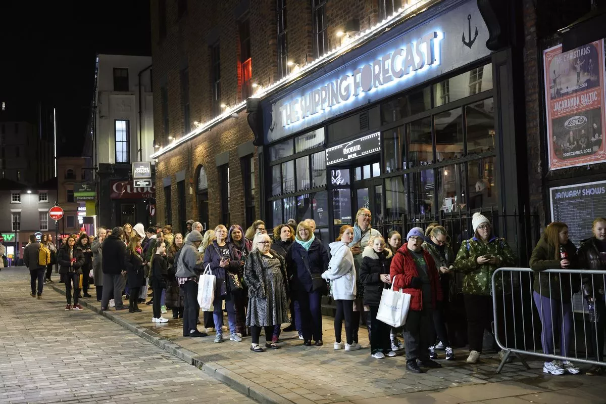 Fans queuing for the Blue album signing at The Jacaranda in Liverpool today